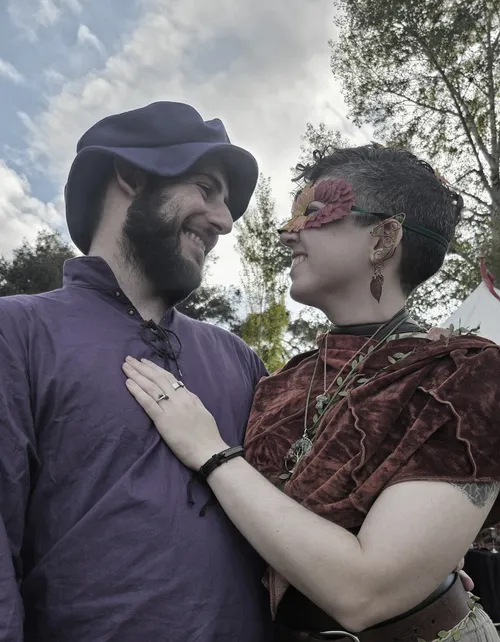 Matt and Des in renaissance faire attire looking lovingly into each others eyes.